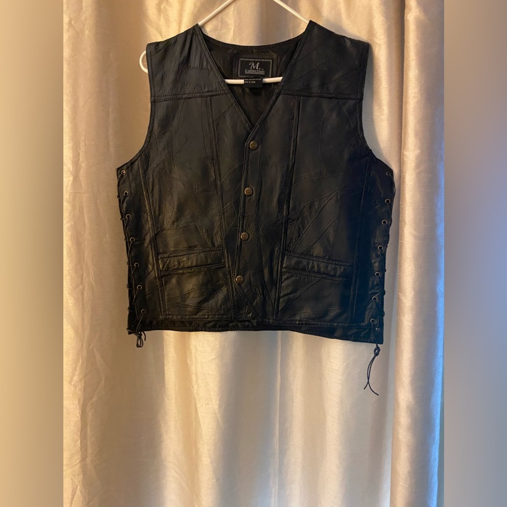 Leather Biker Vest New without tags never worn smoke free and pet free home.